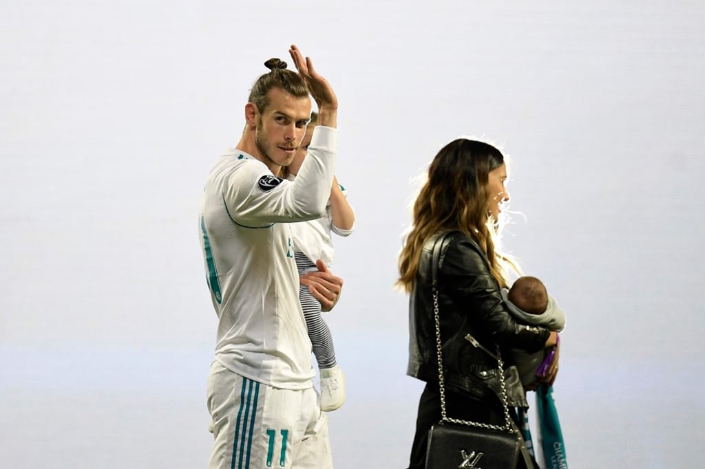 Gareth Bale waves at the Santiago Bernabeu stadium during a victory ceremony after Real Madrid won their third Champions League title in a row in Kiev. Photo: AFP