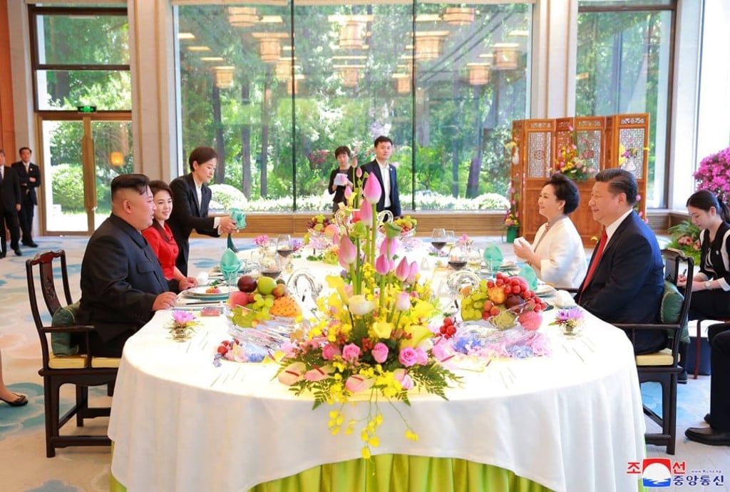 North Korean leader Kim Jong-un and his wife talk with Chinese President Xi Jinping and his wife during a luncheon at Diaoyutai State Guesthouse in Beijing on Wednesday. Photo: Korean Central News Agency/Korea News Service via AP North Korean leader Kim Jong-un and his wife talk with Chinese President Xi Jinping and his wife during a luncheon at Diaoyutai State Guesthouse in Beijing on Wednesday. Photo: Korean Central News Agency/Korea News Service via AP