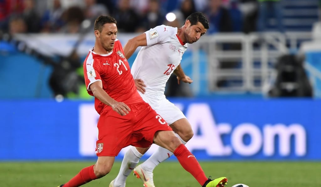 Serbia midfielder Nemanja Matic battles with Switzerland midfielder Blerim Dzemaili. Photo: AFP
