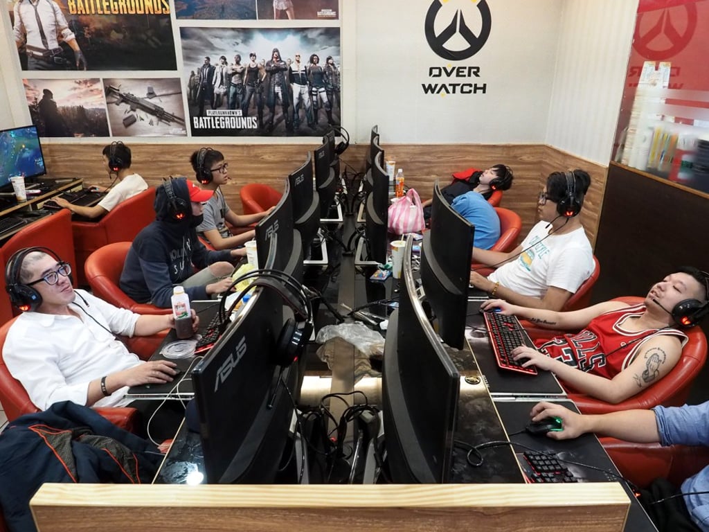 Men play video games in a cyber cafe in Taipei, Taiwan on June 19. Photo: EPA-EFE Men play video games in a cyber cafe in Taipei, Taiwan on June 19. Photo: EPA-EFE
