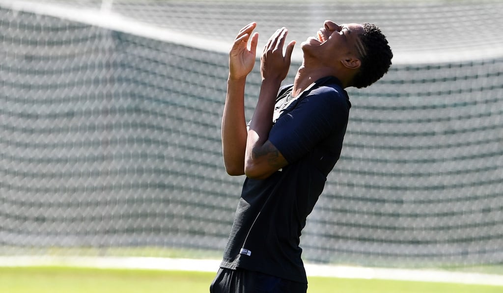 England's forward Marcus Rashford laughs during a training session. Photo: AFP