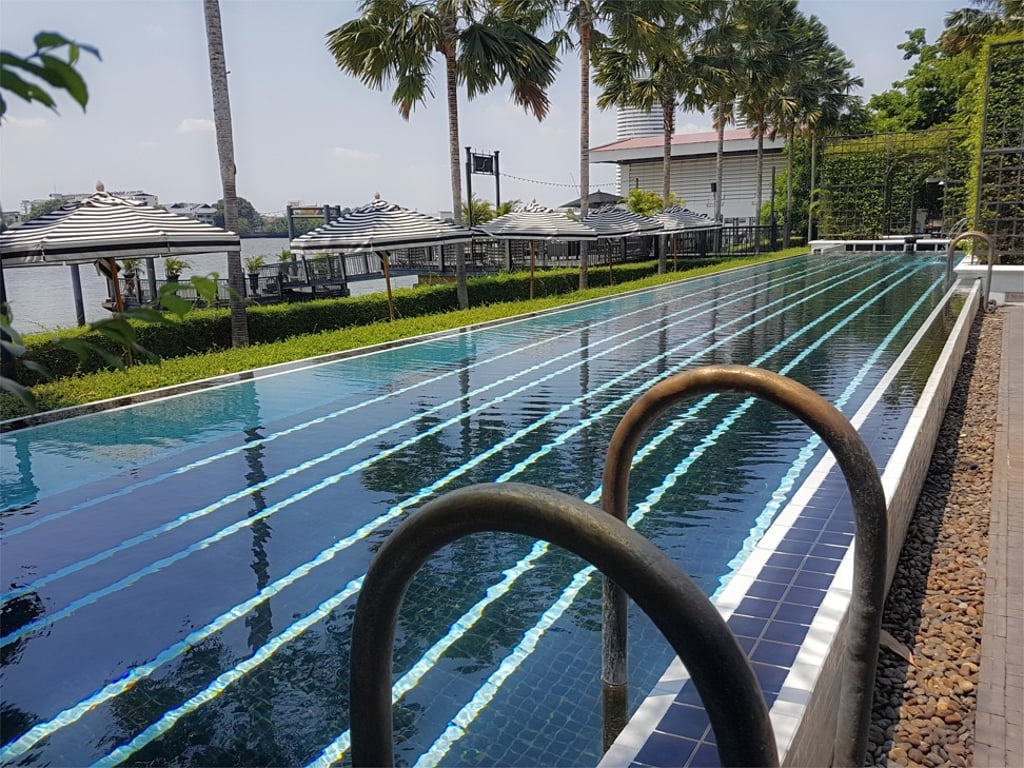 The Siam Bangkok’s swimming pool features stylish geometric patterns.