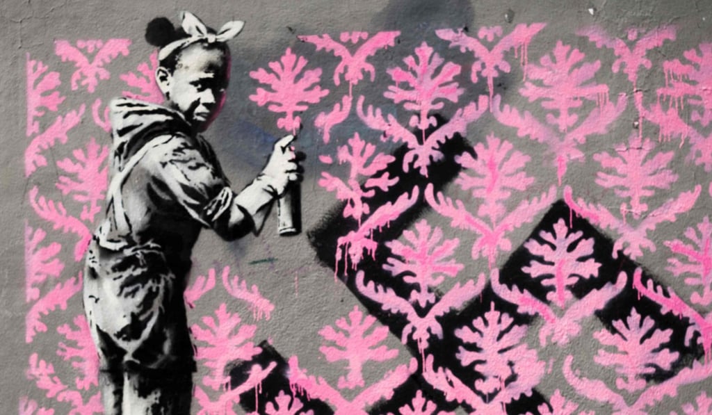 Anonymous street artist Banksy's artwork of a girl painting over a swastika cross has reportedly been first found on World Refugee Day, on June 20, 2018, in northern Paris, near a former centre of initial reception (CPA) for refugees. Photo: AFP/Banksy