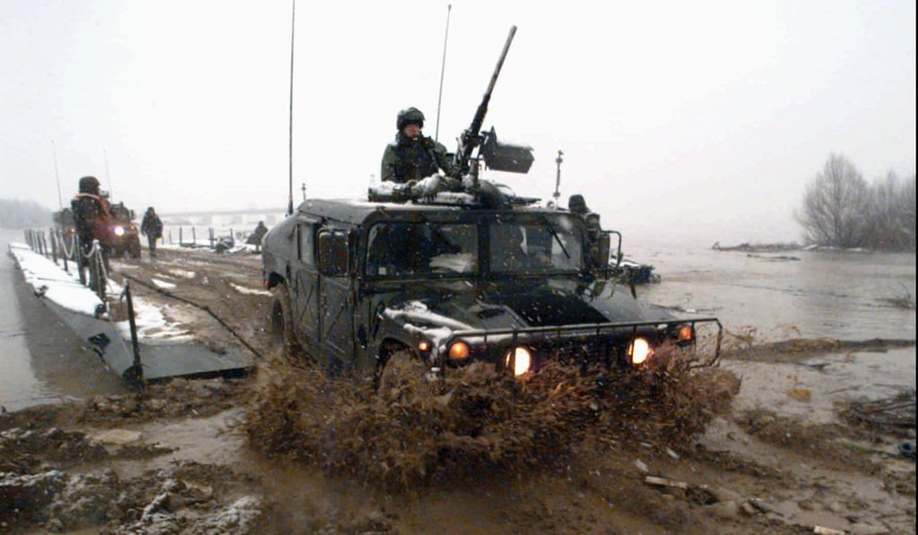 A US Army Humvee arrives in Bosnia as it exits a barge on the Sava River at Vidovice, 80km north of Tuzla, in 1995. Photo: AP