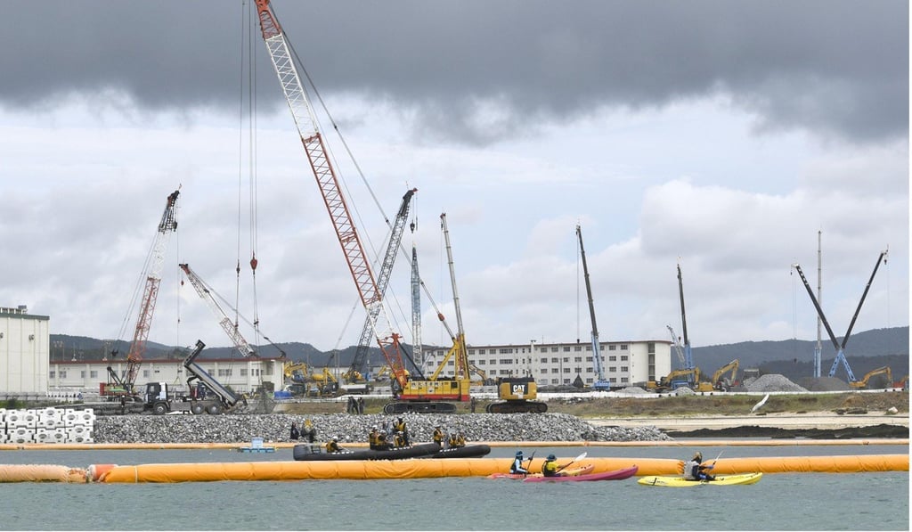 Demonstrators face off against the coastguard off Henoko, Okinawa on June 25, 2018. Photo: Kyodo
