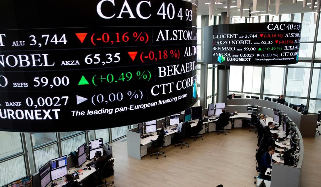 People work at Euronext stock exchanges market in La Defense, near Paris, in 2015. Photo: AFP