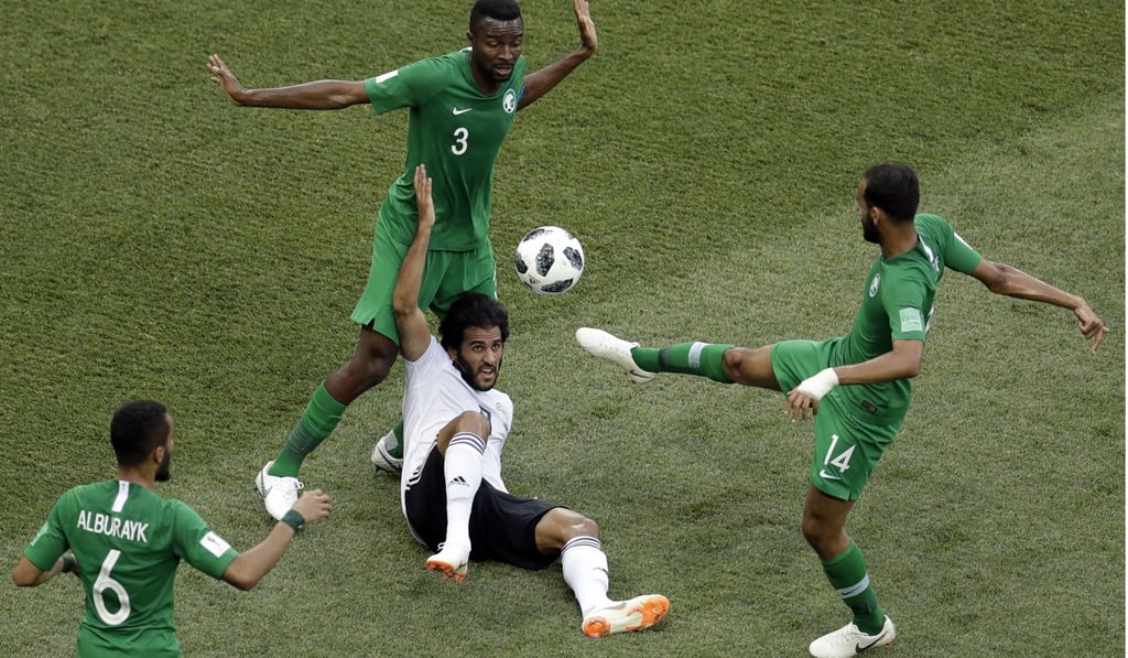 Egypt's Marwan Mohsen is crowded out by Saudi Arabia defenders. Photo: AP