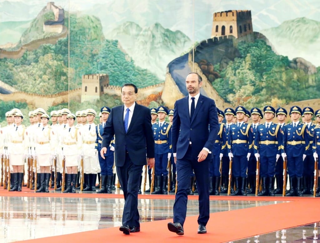 Premier Li Keqiang (left) holds a welcoming ceremony for French Prime Minister Edouard Philippe (right) before their talks at the Great Hall of the People in Beijing. Photo: Xinhua