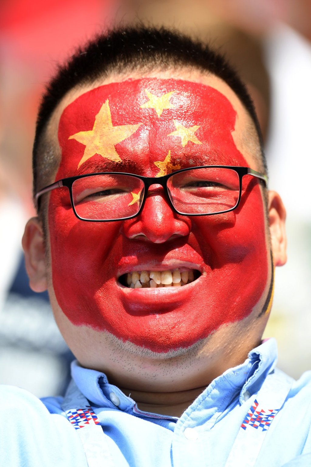 Chinese soccer fans areas passionate as any other, and they enjoy a good snack too. Photo: AFP