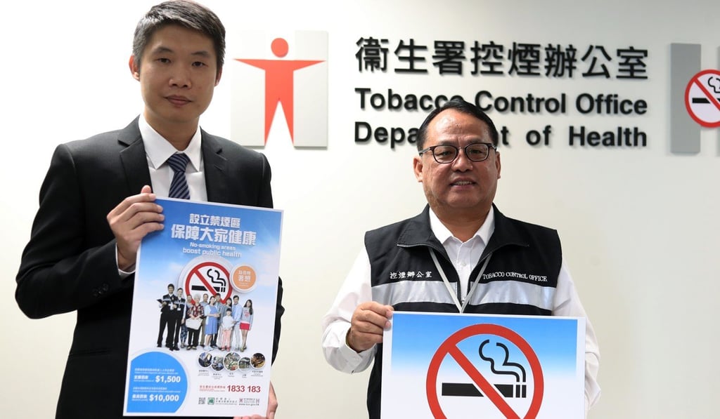 Kuan Chong-hoi (right) with Dr Manny Lam, senior medical and health officer of the Tobacco Control Office. Photo: Winson Wong