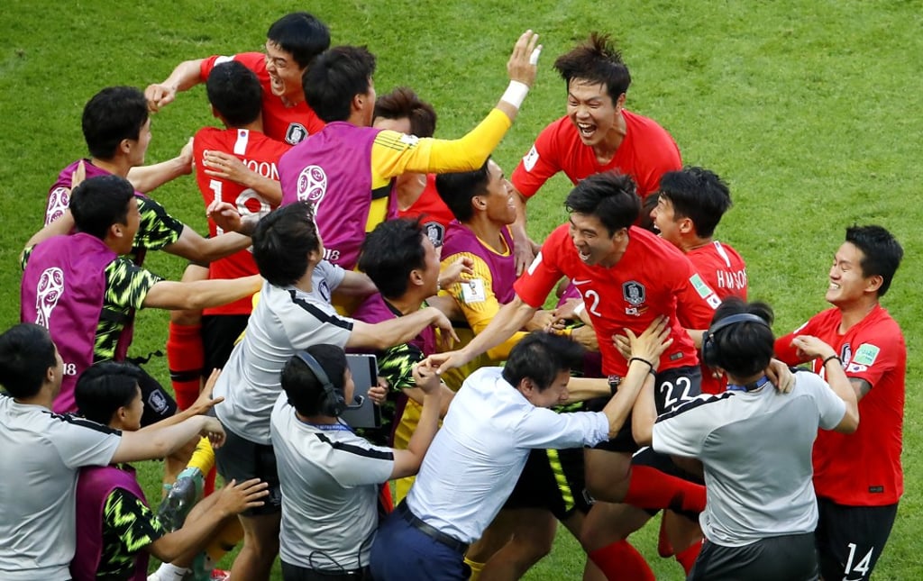 South Korea players celebrate their opening goal. Photo: EPA