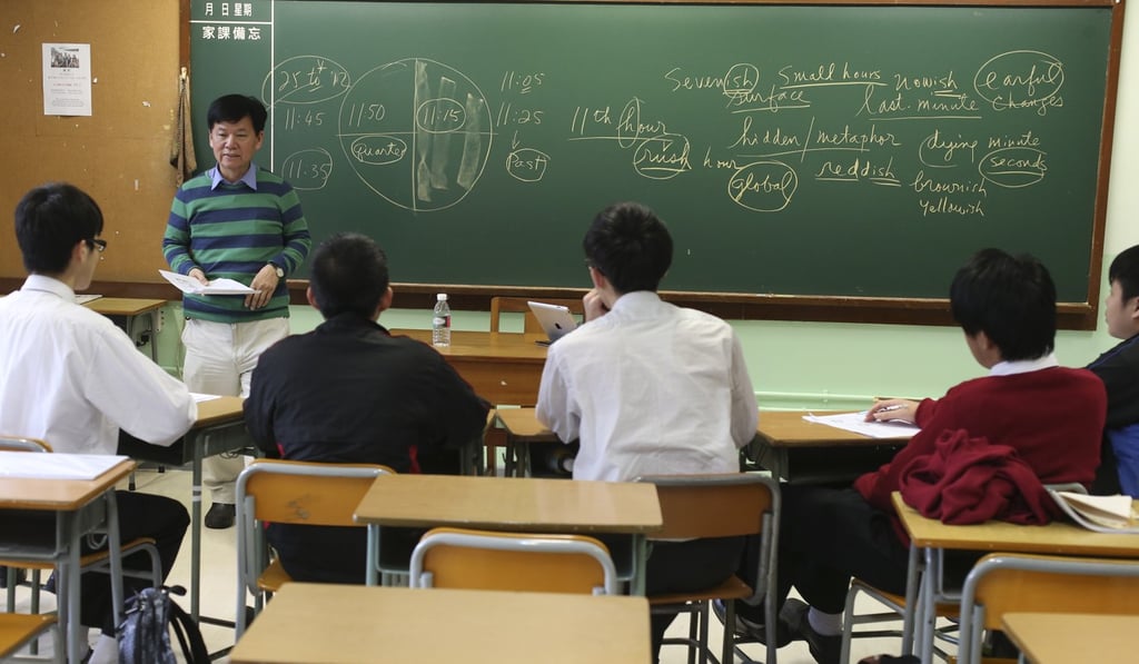 A volunteer teacher gives English lessons to Form Five students from a Band Three school. Photo: K.Y. Cheng