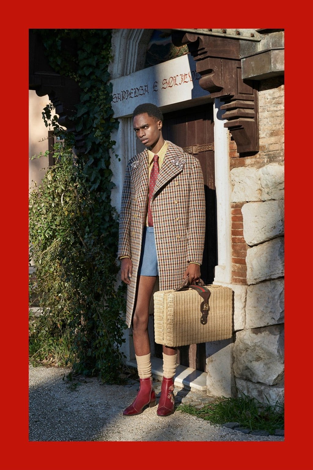A long jacket is matched with shorts and a tie – one of the eccentric looks from the collection. A long jacket is matched with shorts and a tie – one of the eccentric looks from the collection.