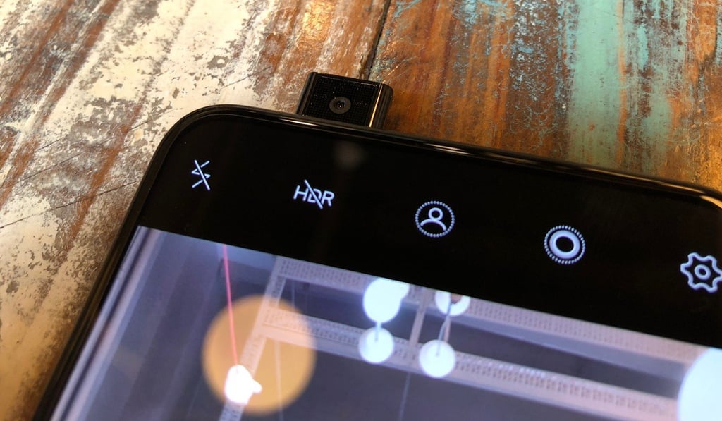 The Vivo Nex eliminates the notch by moving most of the sensors underneath the display and putting the selfie camera in a module that pops up from the top of the device. Photo: Ben Sin