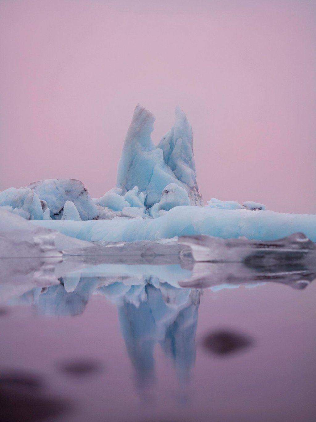 Floating icebergs reflecting in the still waters of Jokulsarlon Glacial Lagoon in Iceland, captured at sunrise. Photo: Lisa Michele Burns Floating icebergs reflecting in the still waters of Jokulsarlon Glacial Lagoon in Iceland, captured at sunrise. Photo: Lisa Michele Burns
