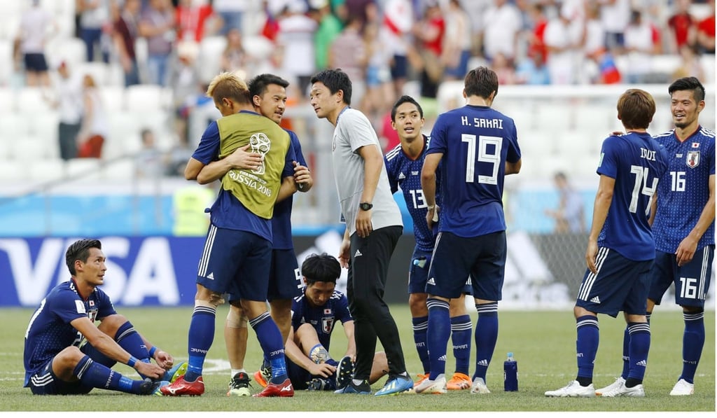 Japan’s manager told his players to adopt a more cautious approach for the last 10 minutes of their defeat against Poland, despite boos from their own fans. Photo: Kyodo