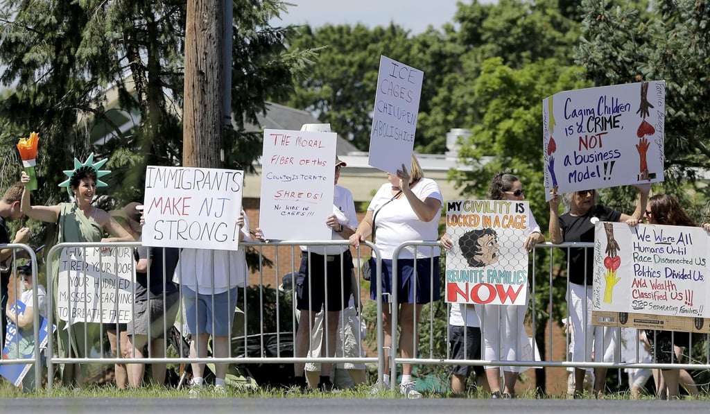 Protesters rally against Donald Trump at Clarence Dillon Public Library, not far from Trump National Golf Club, where Trump was staying this weekend. Photo: AP Protesters rally against Donald Trump at Clarence Dillon Public Library, not far from Trump National Golf Club, where Trump was staying this weekend. Photo: AP