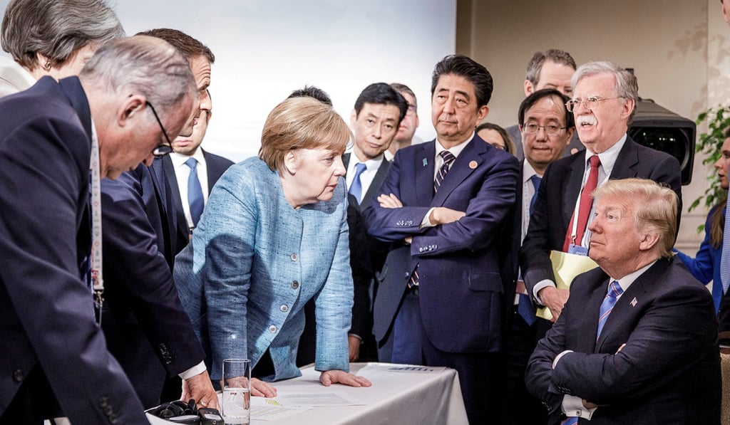 At the recent rancorous G7 summit in Quebec, Donald Trump reportedly threw confectionery down on the table in front of Angela Merkel, saying: ‘Don’t say I never give you anything’. Photo: Reuters