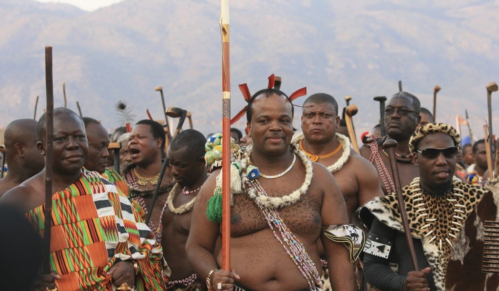King Mswati III (C) flanked by his entourage and security guards. File photo: DPA