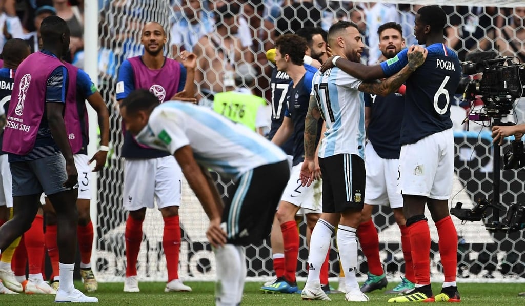 Argentina defender Nicolas Otamendi is comforted by France’s Paul Pogba after their last-16 encounter in the World Cup. Photo: AFP