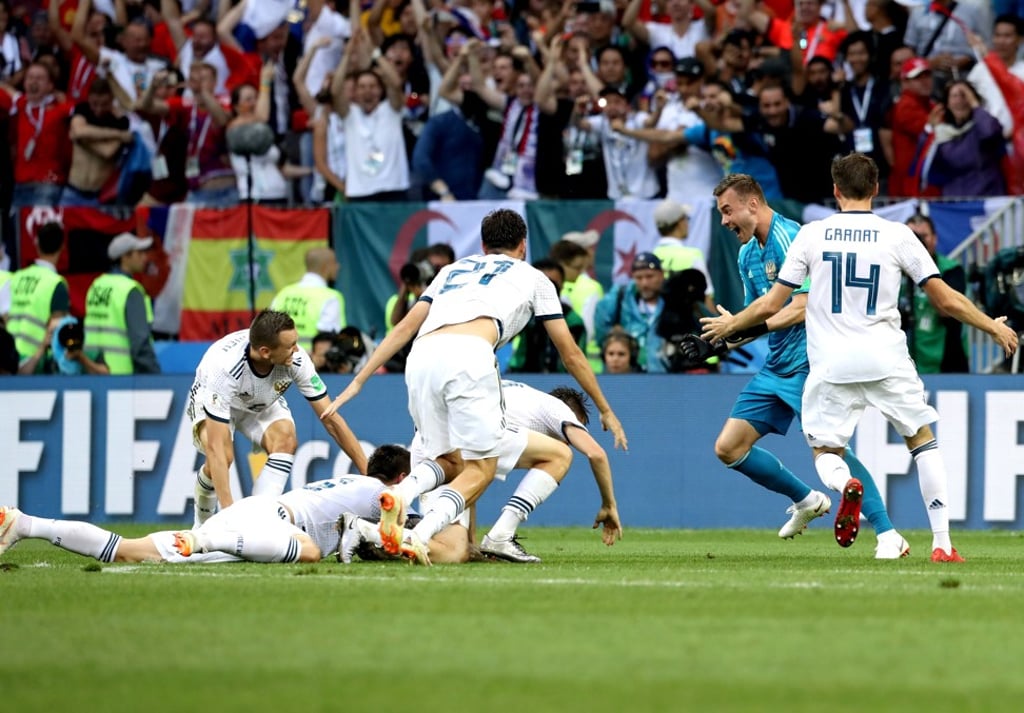 Russia’s players celebrate their shoot-out victory. Photo: EPA