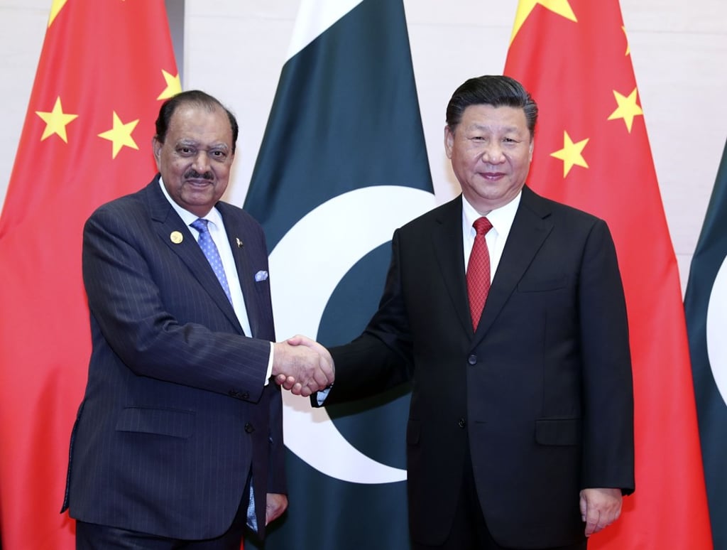 The China-Pakistan Economic Corridor is central to China’s “Belt and Road Initiative”, a pet project of President Xi Jinping (right), pictured meeting Pakistan’s President Mamnoon Hussain in Qingdao on June 9. Photo: Xinhua