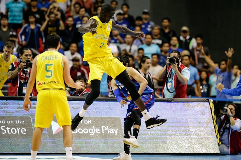 Australia’s Thon Maker attempts to kick Terrence Romeo of the Philippines. Photo: EPA Australia’s Thon Maker attempts to kick Terrence Romeo of the Philippines. Photo: EPA