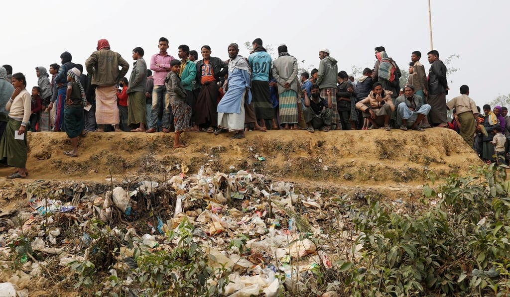 Rohingya refugees line up for daily essentials distribution at the Balukhali camp. Photo: Reuters
