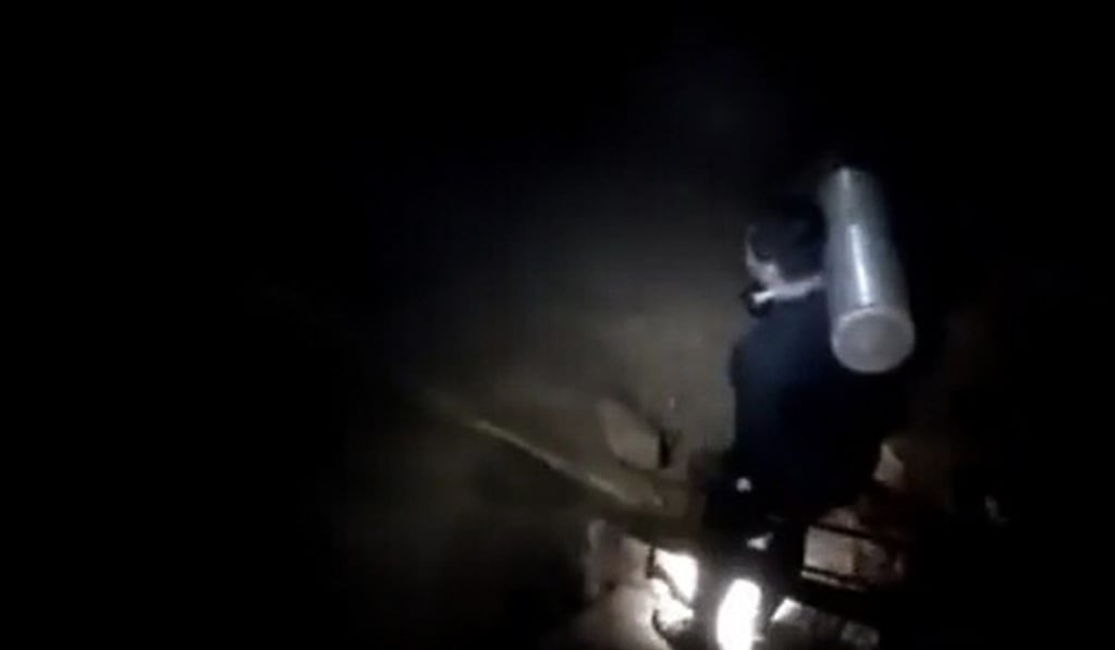 An undated handout photo shows a Thai Navy Seal diver deep inside the Tham Luang cave complex. Photo: EPA An undated handout photo shows a Thai Navy Seal diver deep inside the Tham Luang cave complex. Photo: EPA