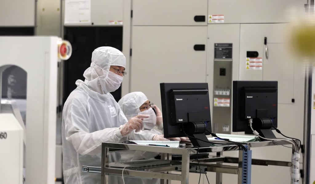 Workers in the clean room of a wafter fab operated by SMIC (Semiconductor Manufacturing International Corporation) in Beijing. Photo: Handout