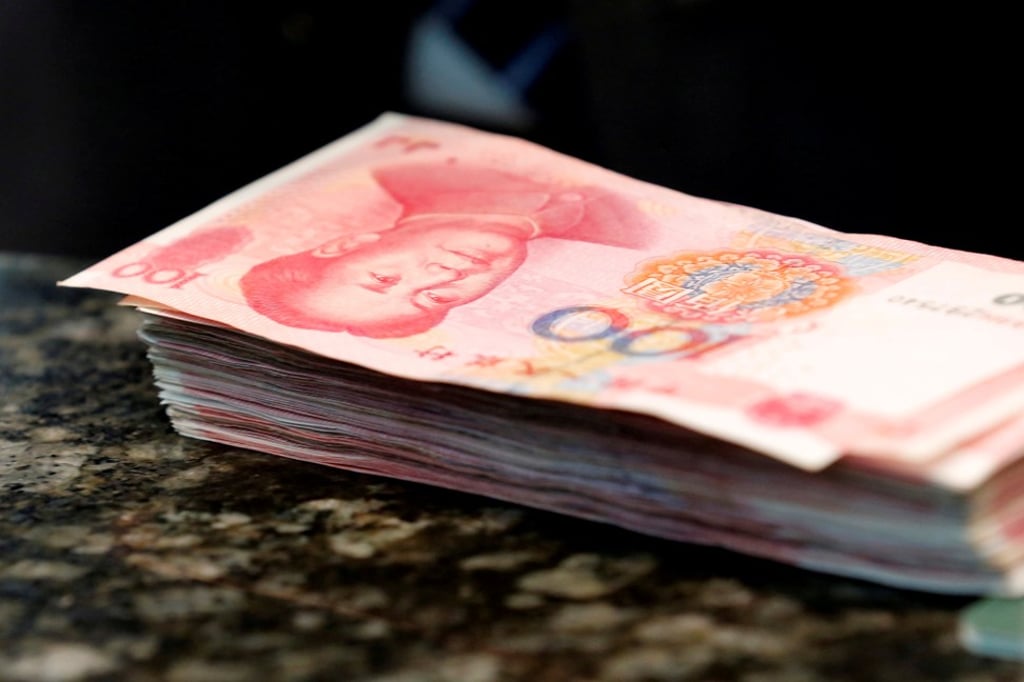 Chinese 100 yuan banknotes are seen on a counter of a branch of a commercial bank in Beijing, China in 2016. Photo: Reuters