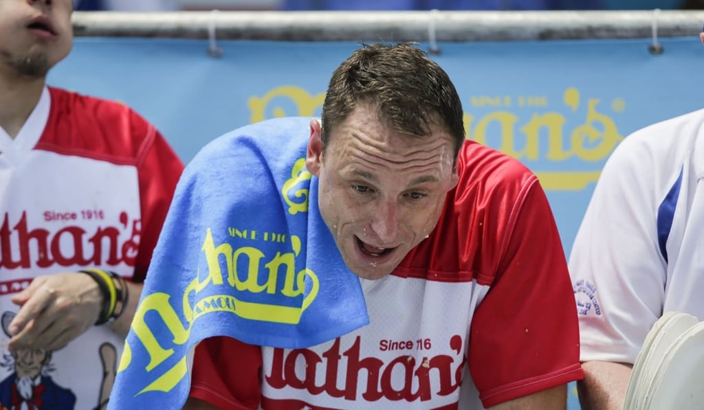 Joey Chestnut pauses for breath during the annual Nathan's Hot Dog Eating Contest. Photo: Agence France-Presse