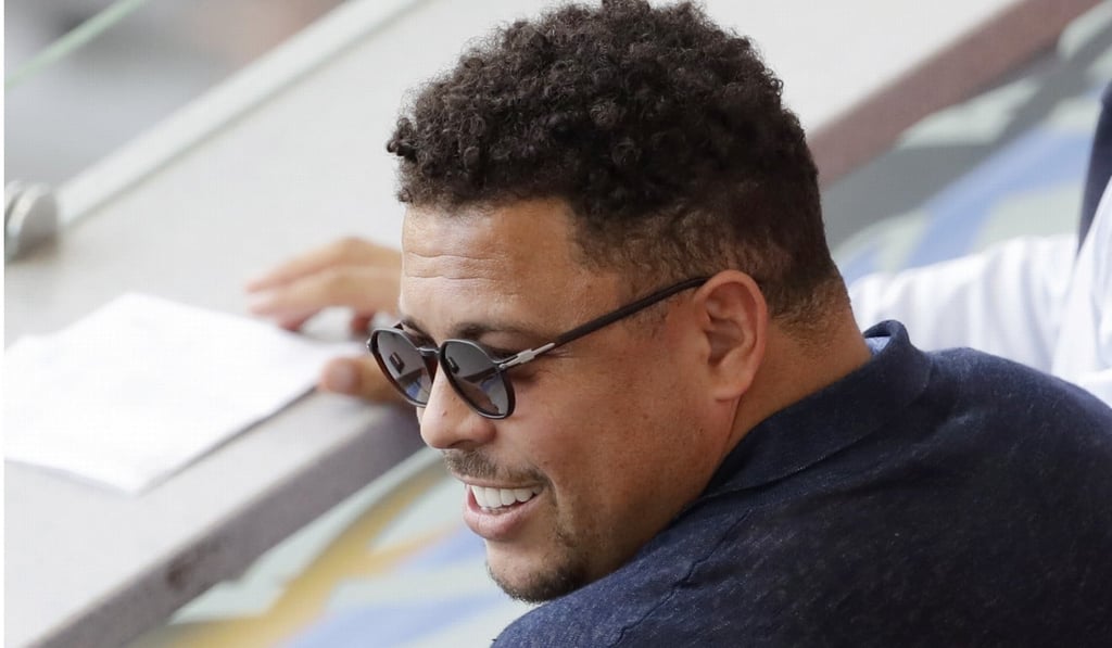 Former Brazil player Ronaldo watches the round of 16 match between France and Argentina. Photo: AP