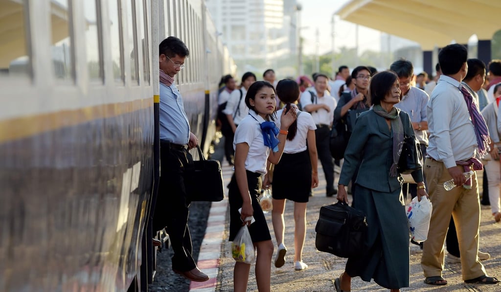 Passengers step out of a train at Phnom Penh railway station after the train travelled from the northwestern province of Pursat using the newly restored railway. Photo: AFP