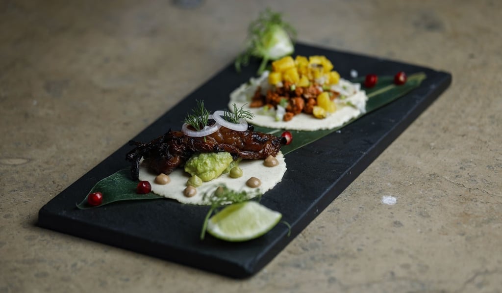 Lobster drunk on tequila taco (front) and al pastor taco at Los Sotano. Photo: Tory Ho