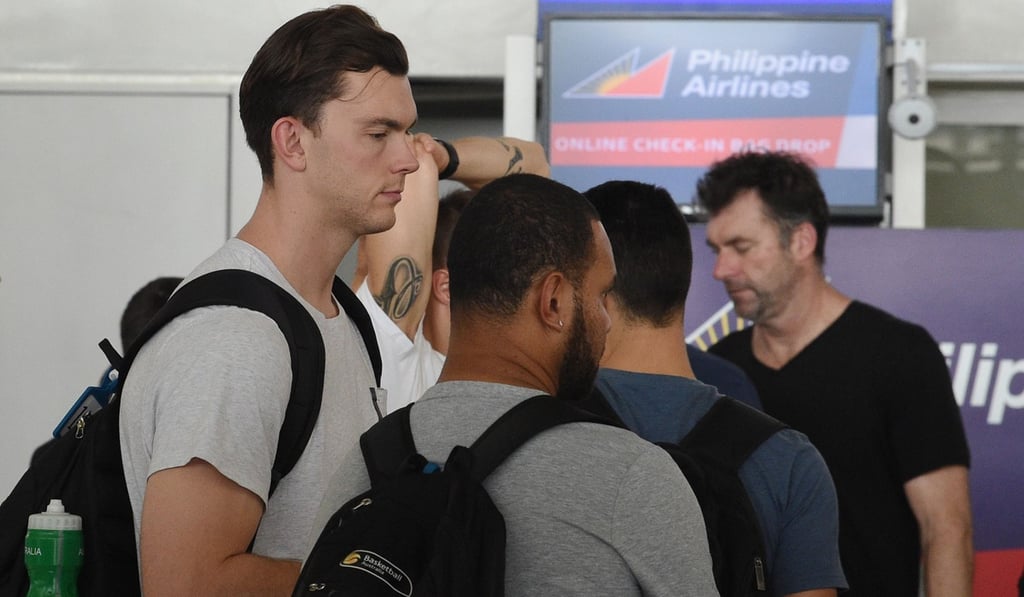 Australian basketball players leave Manila after their bust-up with the Philippines. Photo: AFP