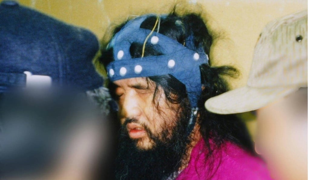 This file picture taken on May 16, 1995 shows doomsday cult leader Shoko Asahara being arrested at the cult's headquarters in Kamikuishiki village in Yamanashi prefecture. Photo: Agence France-Presse