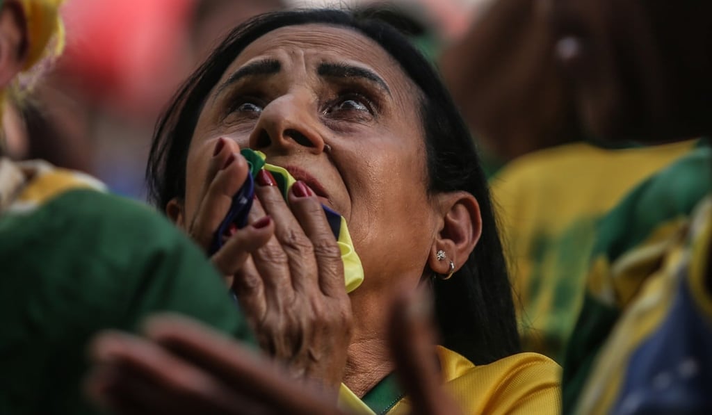 A Brazilian soccer fan reacts during the quarter-final loss to Belgium. Photo: Xinhua