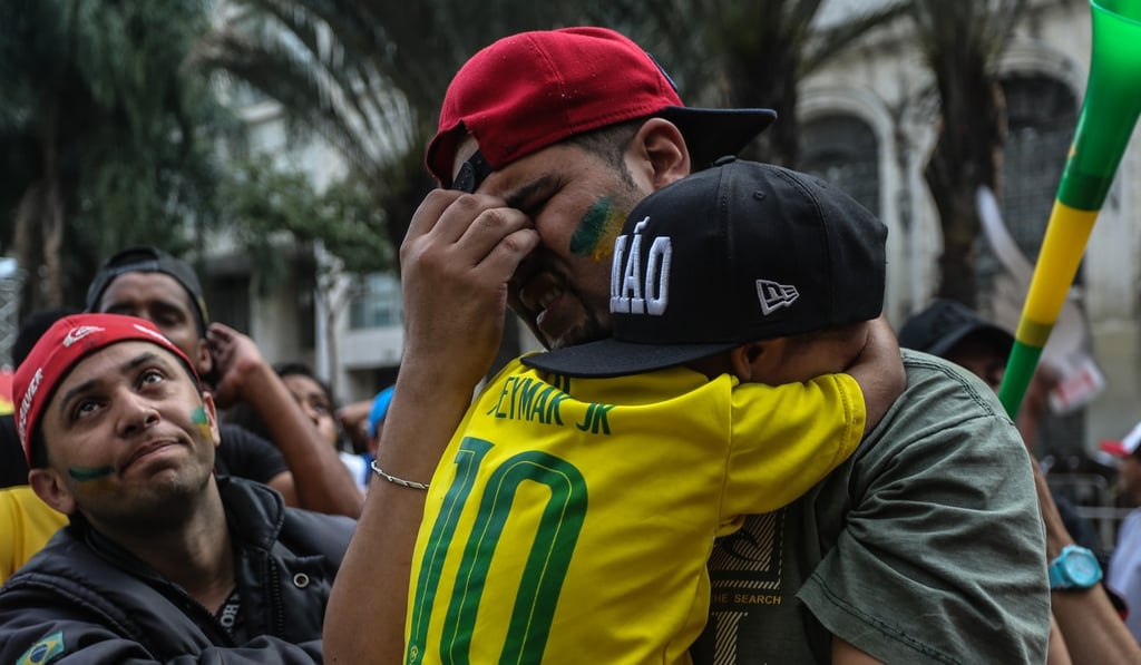 Brazilian fans react after the defeat to Belgium. Photo: Xinhua