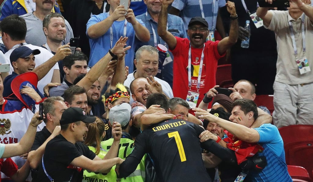 Thibaut Courtois is mobbed by Belgium supporters after the quarter-final win over Brazil. Photo: EPA