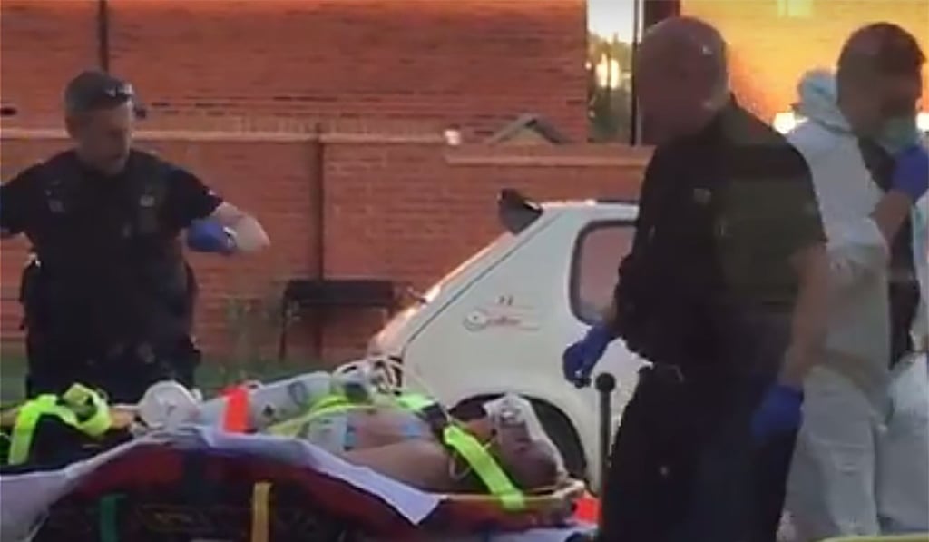 A still image taken from video recorded on June 30 shows a man believed to be Charlie Rowley being removed from his home after being poisoned with Soviet-era nerve toxin Novichok. Photo: AFP/AFPTV