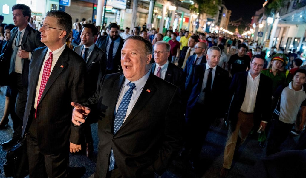 US Secretary of State Mike Pompeo, centre, walking through the streets of Hanoi on Sunday. Photo: AFP