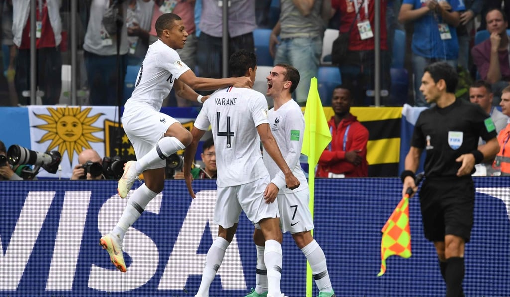 France players celebrate a goal during the game against Uruguay. Photo: AFP