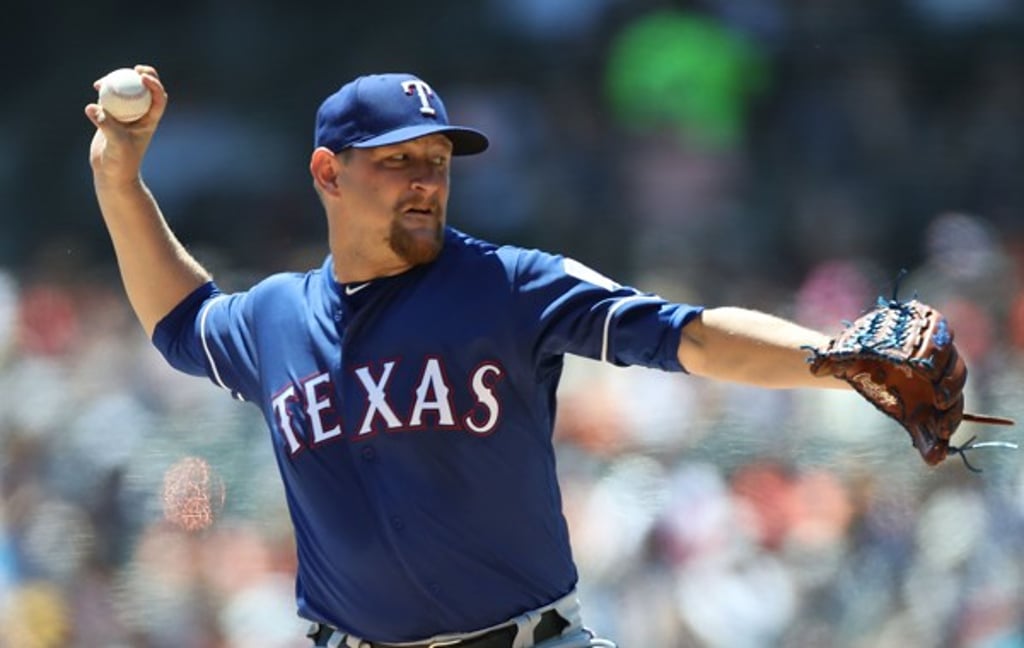 Austin Bibens-Dirkx of the Texas Rangers pitches during the third inning of the game against the Detroit Tigers at Comerica Park earlier this month. Photo: AFP Austin Bibens-Dirkx of the Texas Rangers pitches during the third inning of the game against the Detroit Tigers at Comerica Park earlier this month. Photo: AFP