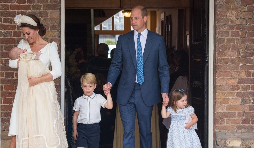 Prince George and Princess Charlotte hold hands with their father, Britain's Prince William, as Prince Louis is carried by his mother, Kate, after his christening service on Monday in London. Photo: Pool via AFP