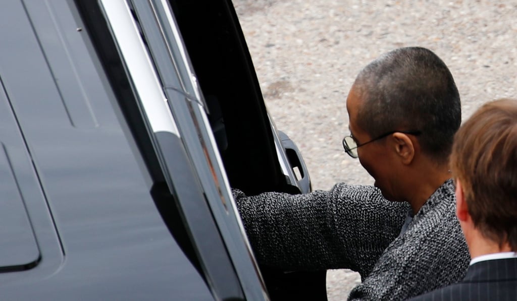 Liu Xia (left), the widow of Chinese Nobel Peace Prize laureate Liu Xiaobo, gets in to a car after she arrives at Tegel Airport in Berlin on Tuesday. Photo: AFP