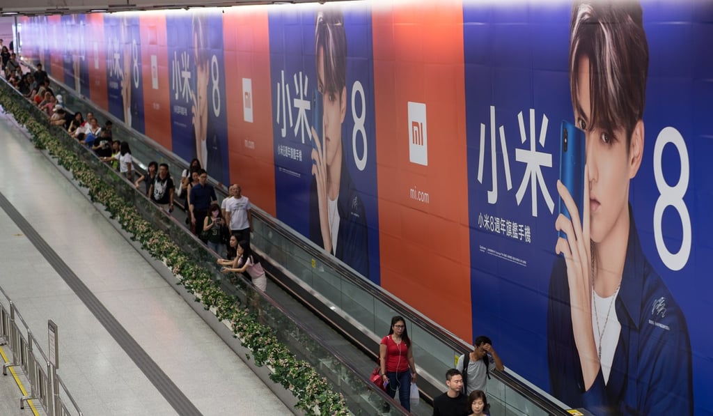 Xiaomi closed below its IPO price on the first day of trading. Photo: EPA Xiaomi closed below its IPO price on the first day of trading. Photo: EPA