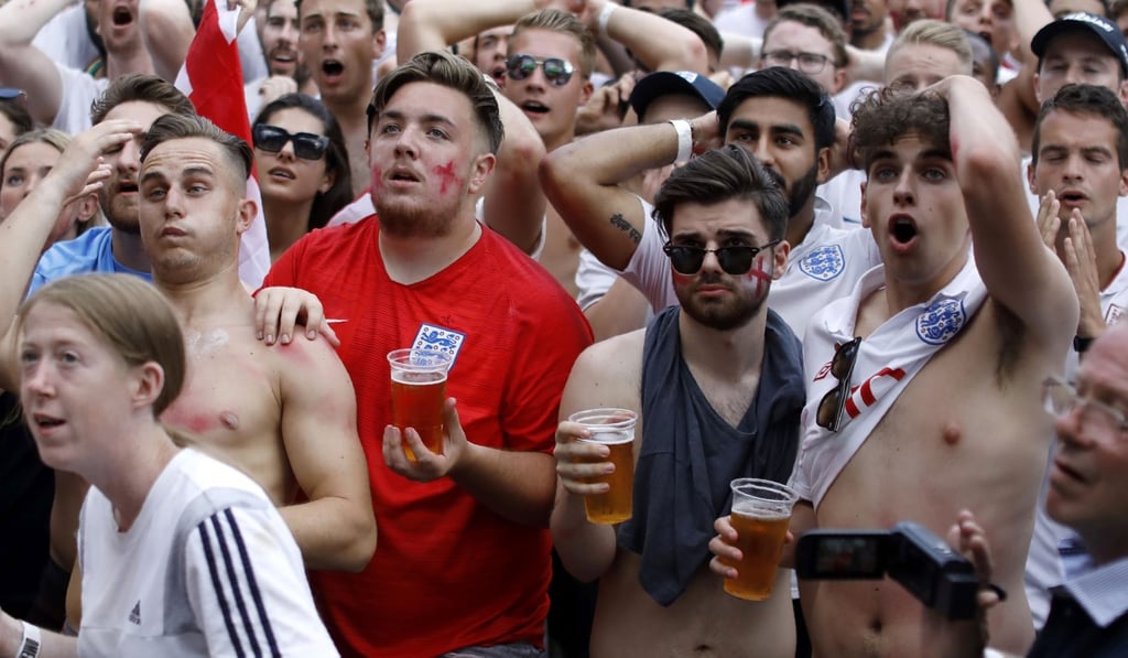 England fans watch the World Cup quarter-final win against Sweden. Photo: AFP England fans watch the World Cup quarter-final win against Sweden. Photo: AFP