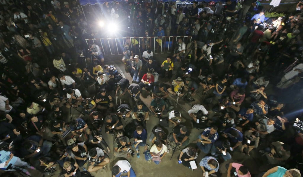 Thai media listen Chiang Rai province acting govnor Narongsak Osatanakorn, who is leading the ongoing rescue operation of the soccer team and coach trapped in a flooded cave. Photo: AP Thai media listen Chiang Rai province acting govnor Narongsak Osatanakorn, who is leading the ongoing rescue operation of the soccer team and coach trapped in a flooded cave. Photo: AP