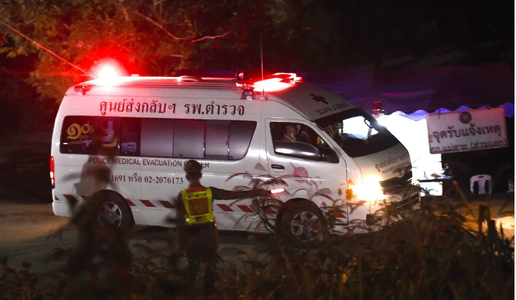 An ambulance allegedly transporting rescued members of the football leaves Tham Luang cave area. Photo: AFP An ambulance allegedly transporting rescued members of the football leaves Tham Luang cave area. Photo: AFP